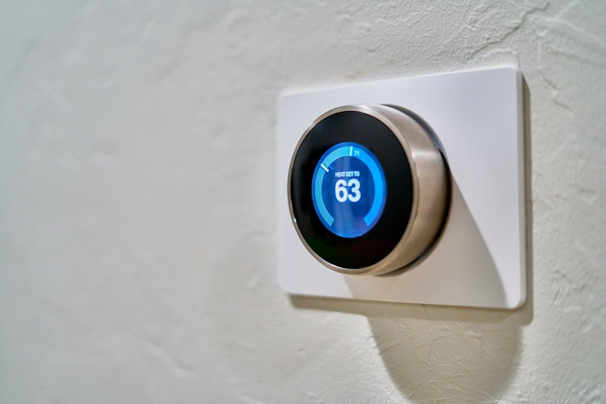 Modern digital smart thermostat displaying residential temperature control for efficient HVAC cooling